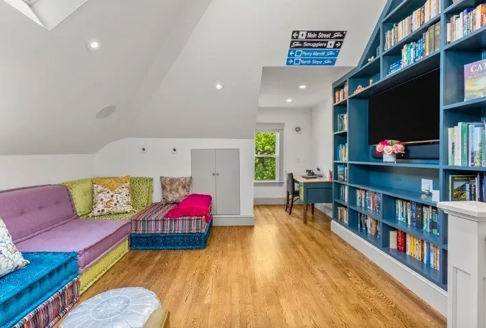 Top-floor family room with built-in shelving in a Beals Street condominium