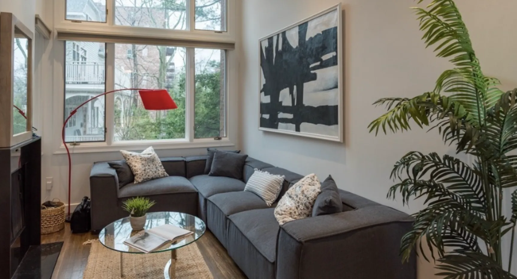 Living room with tall windows in a Chauncy Lane condominium