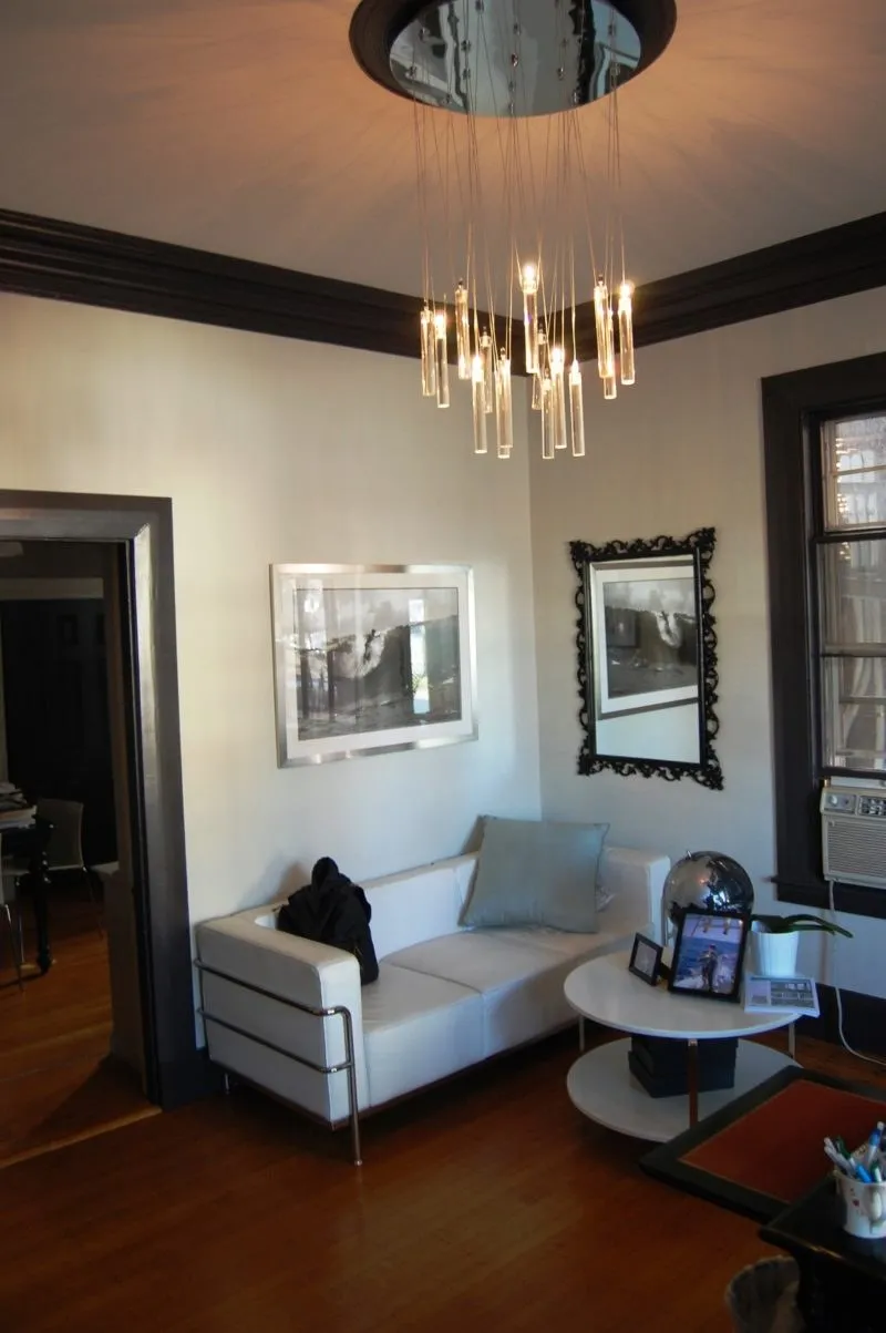 Office lounge with a modern chandelier and dark trim