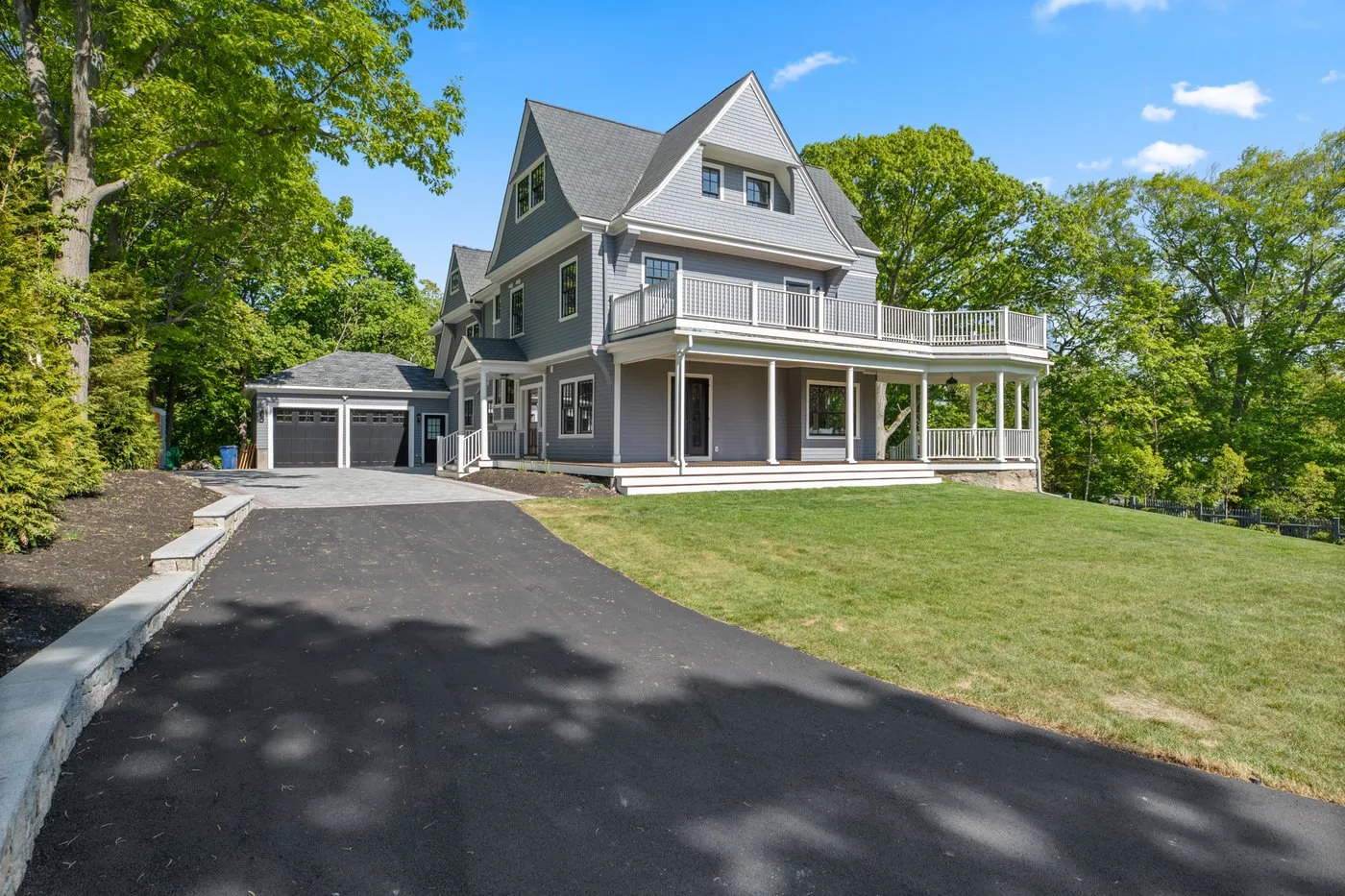 Driveway, arrival court, and new attached garage at a Newton Victorian, an Abrams Builders project