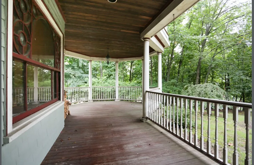 Restored wraparound porch on a Newton Victorian, an Abrams Builders project